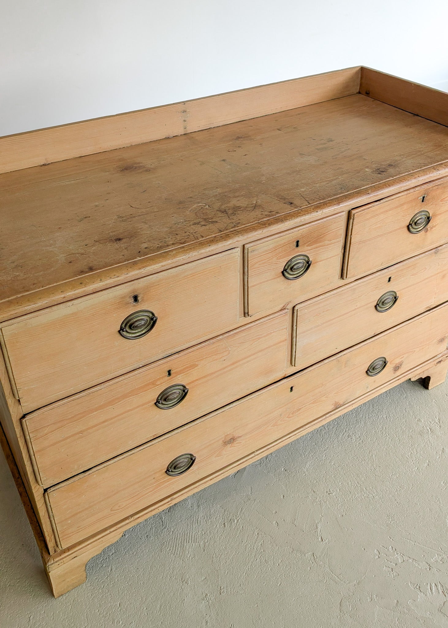 Wide Antique English Pine Chest of Drawers with Trim Top