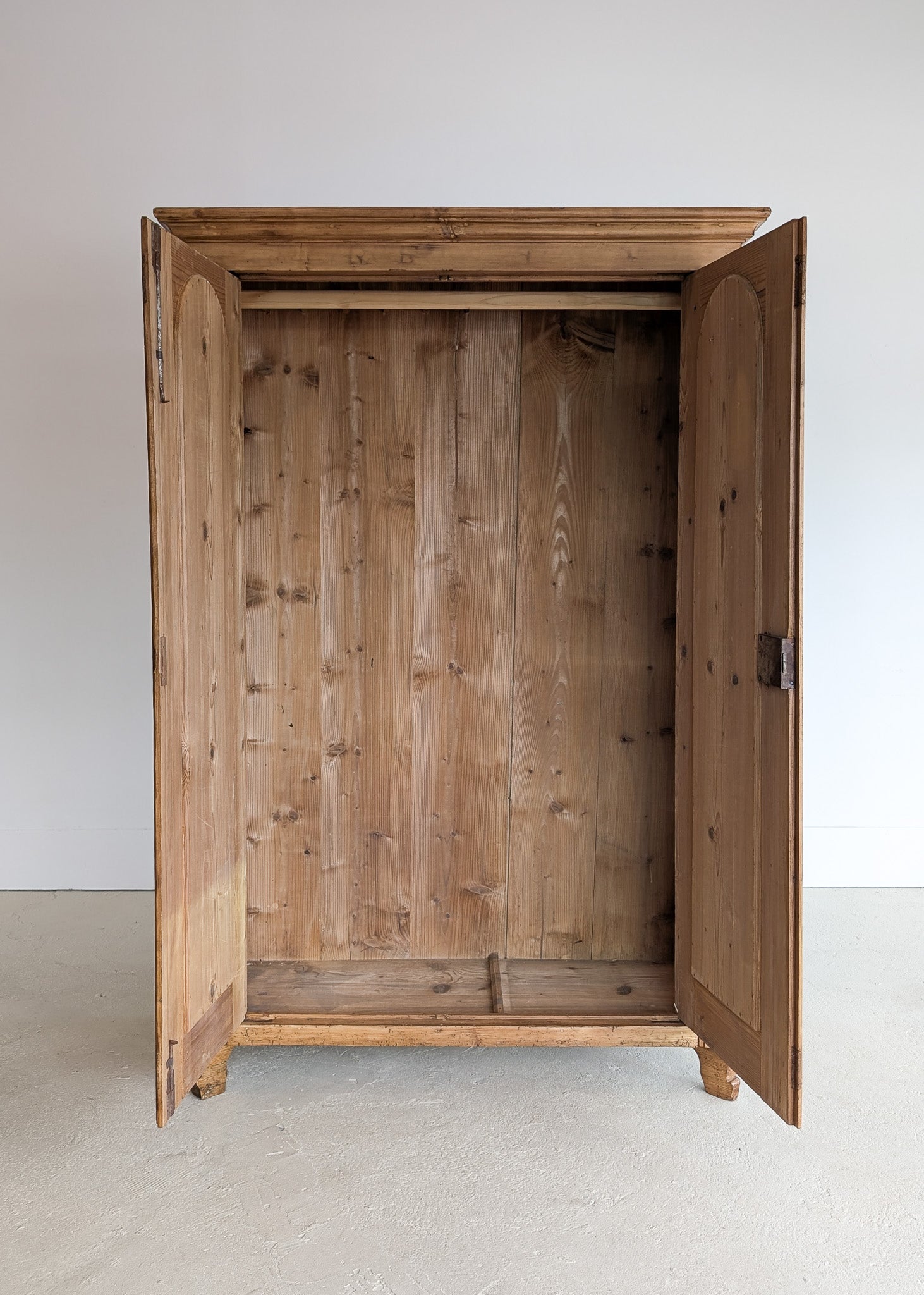 Handsome Antique European Pine Cabinet with Arched Panel Doors, Carved Feet and Skeleton Key