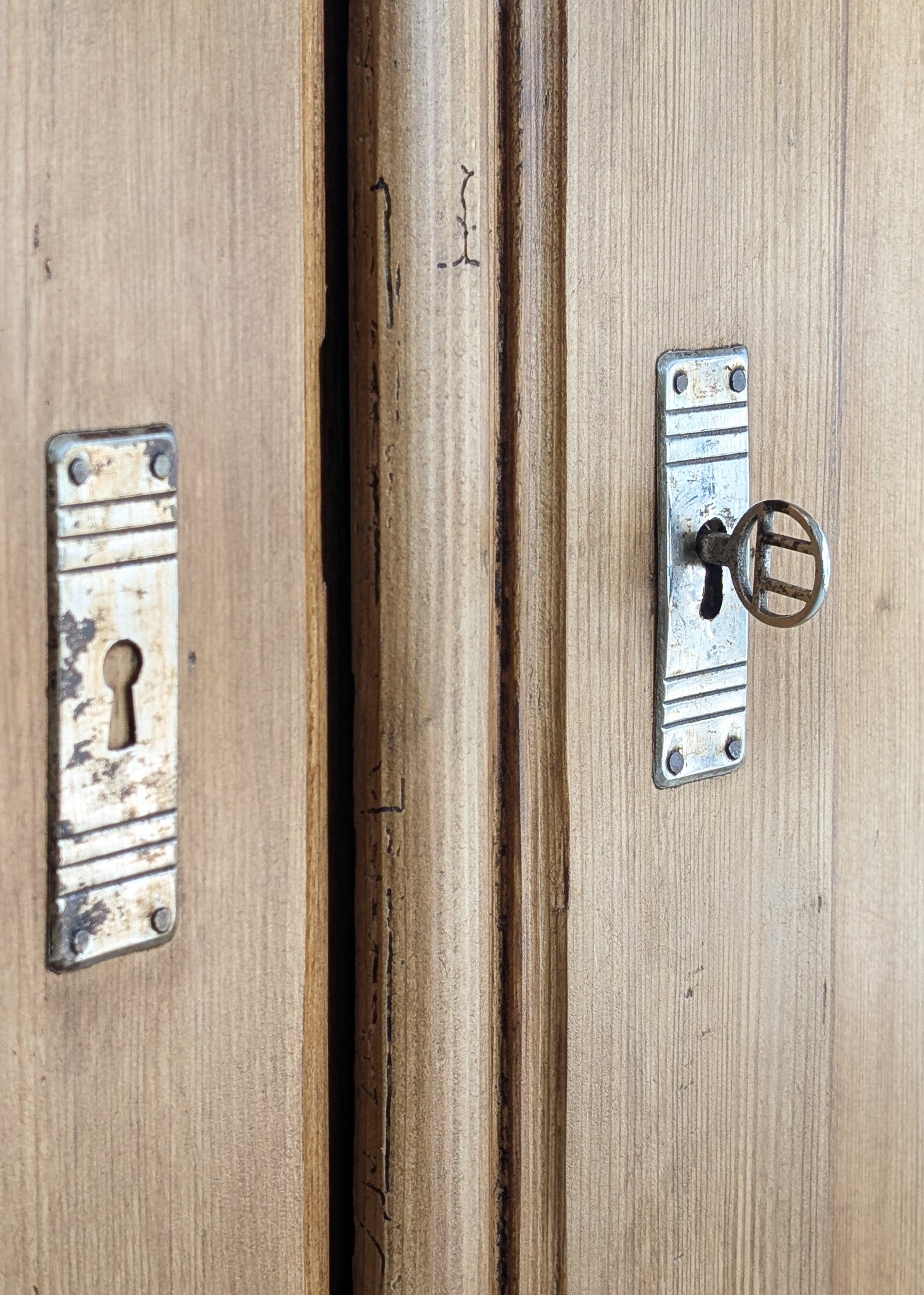 Handsome Antique European Pine Cabinet with Arched Panel Doors, Carved Feet and Skeleton Key