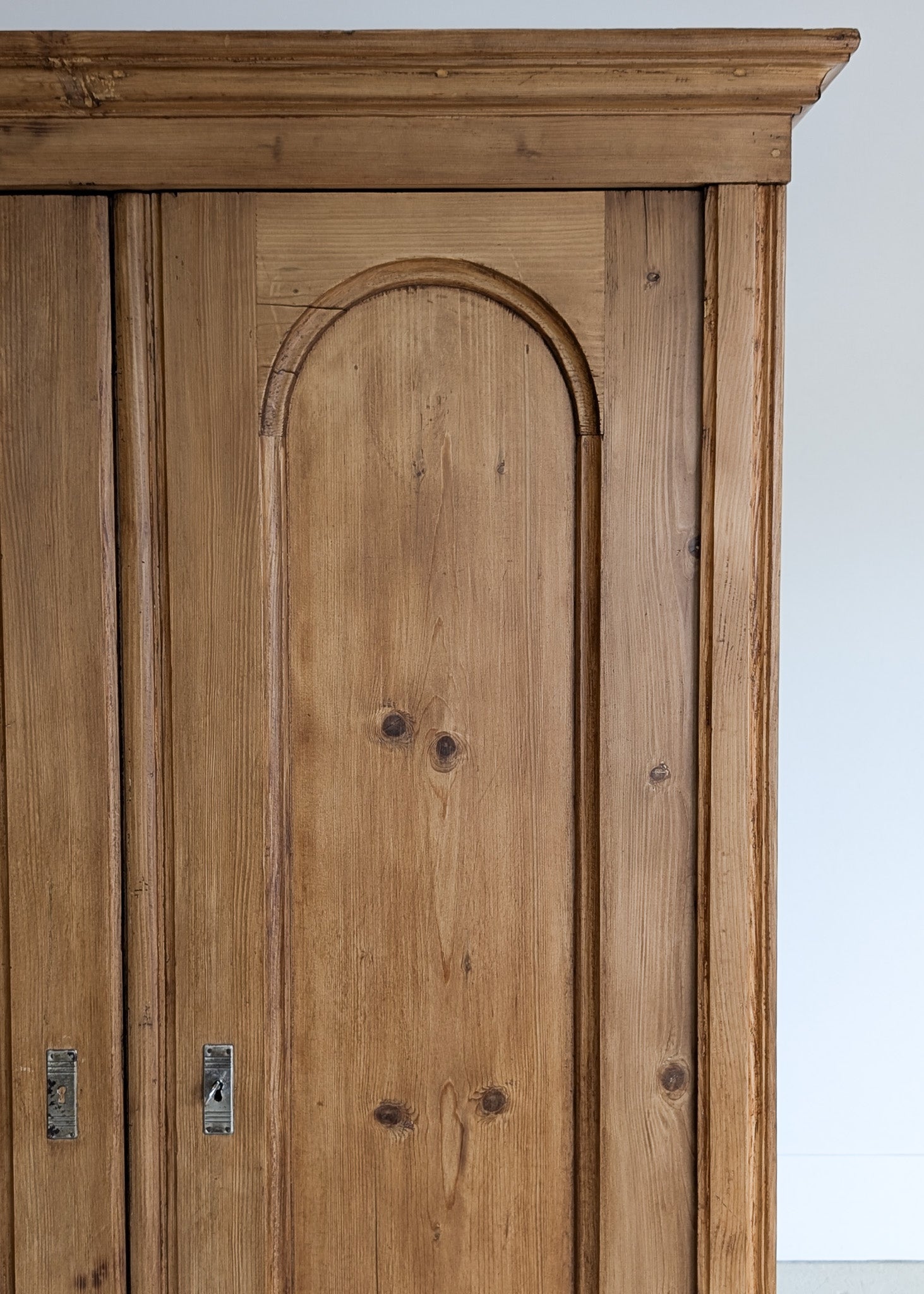 Handsome Antique European Pine Cabinet with Arched Panel Doors, Carved Feet and Skeleton Key