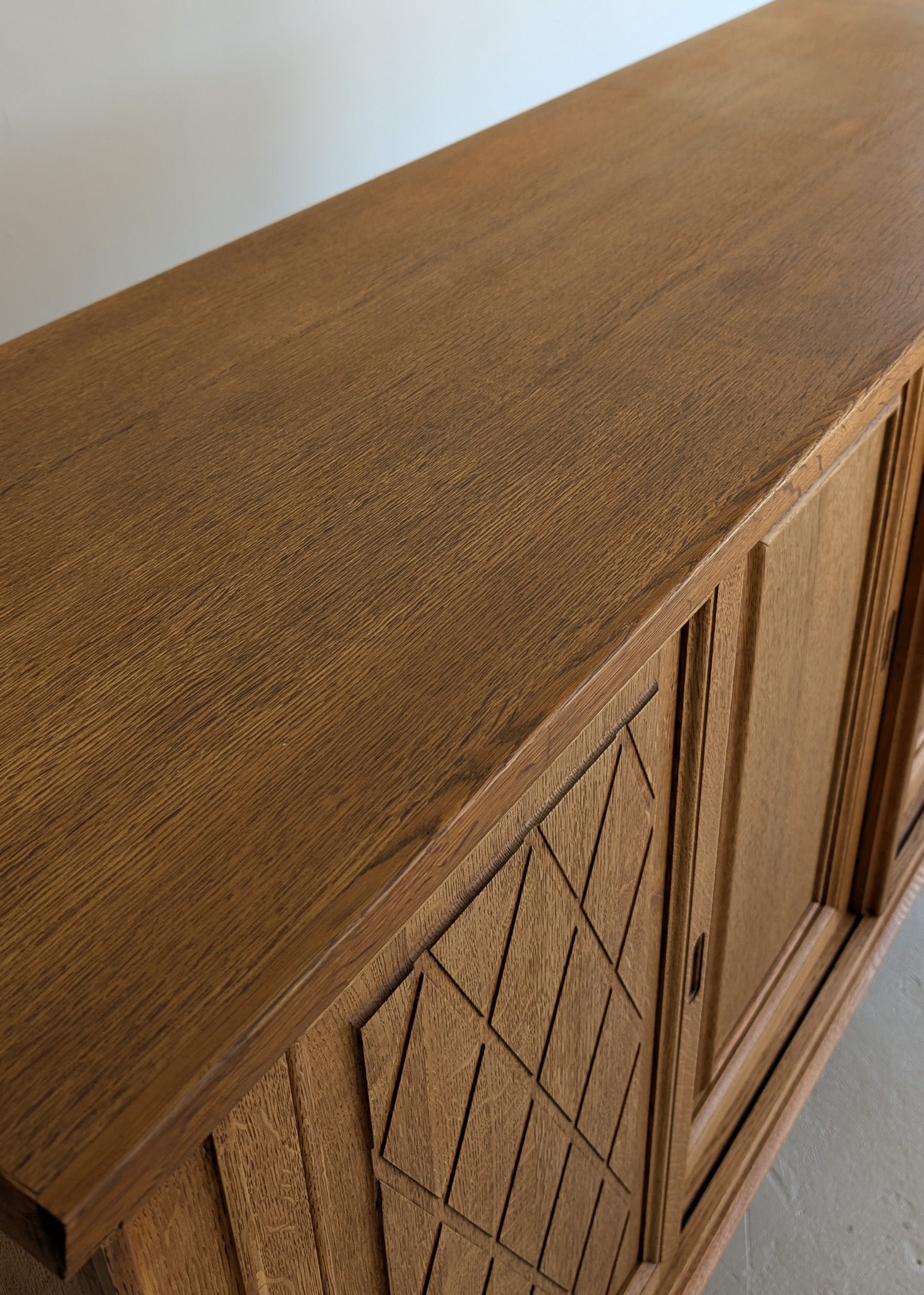 Vintage Midcentury Danish Henning Kjærnulf-Attributed Tall Oak Sideboard Cabinet with Carved Sliding Doors
