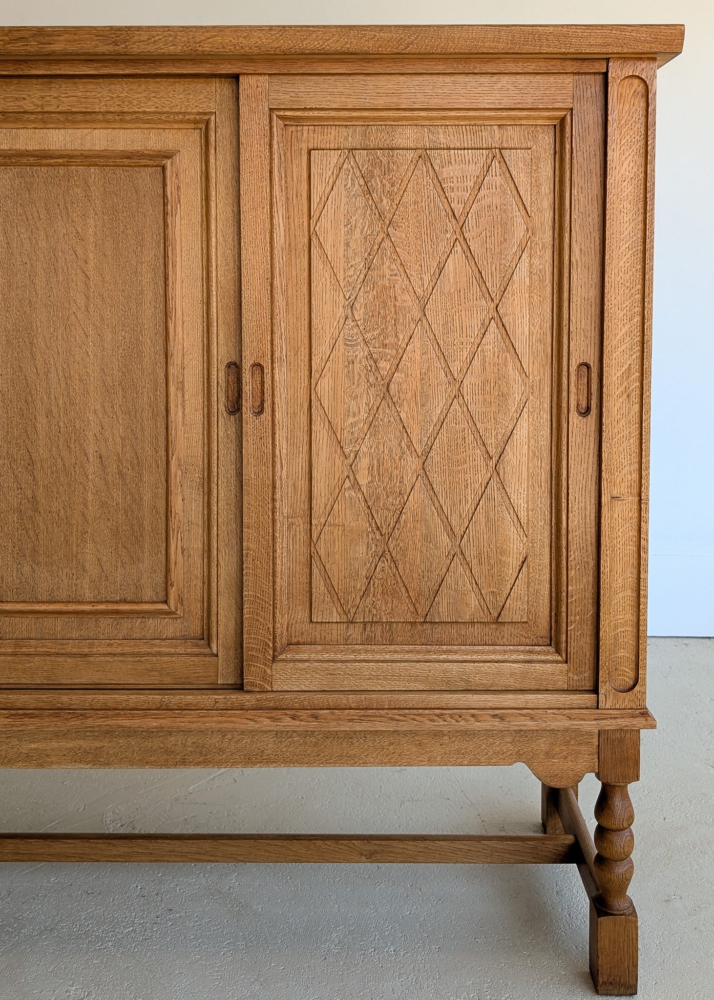 Vintage Midcentury Danish Henning Kjærnulf-Attributed Tall Oak Sideboard Cabinet with Carved Sliding Doors