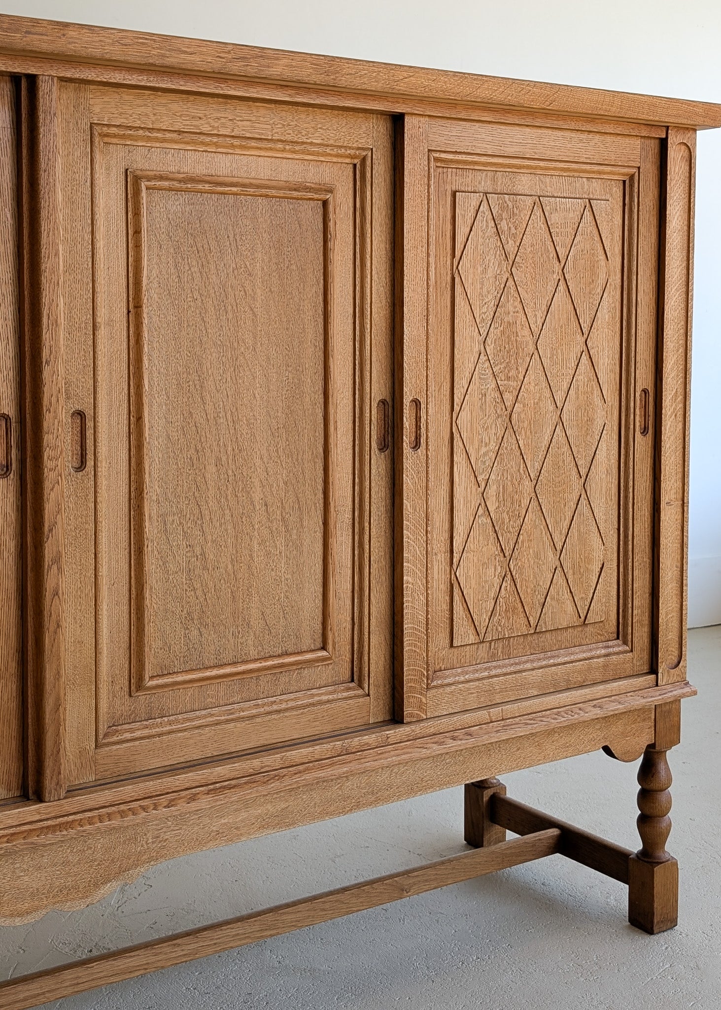 Vintage Midcentury Danish Henning Kjærnulf-Attributed Tall Oak Sideboard Cabinet with Carved Sliding Doors