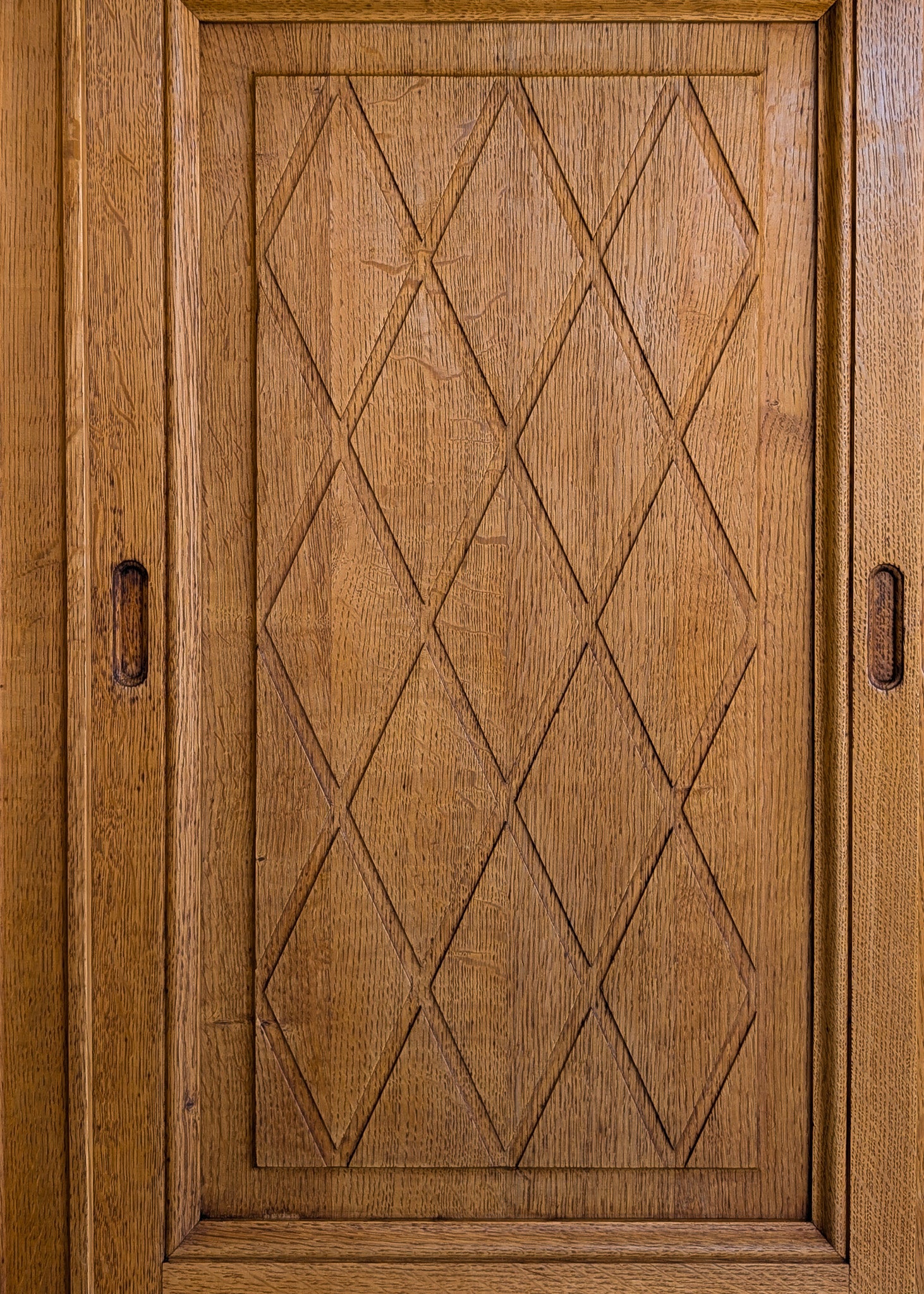 Vintage Midcentury Danish Henning Kjærnulf-Attributed Tall Oak Sideboard Cabinet with Carved Sliding Doors