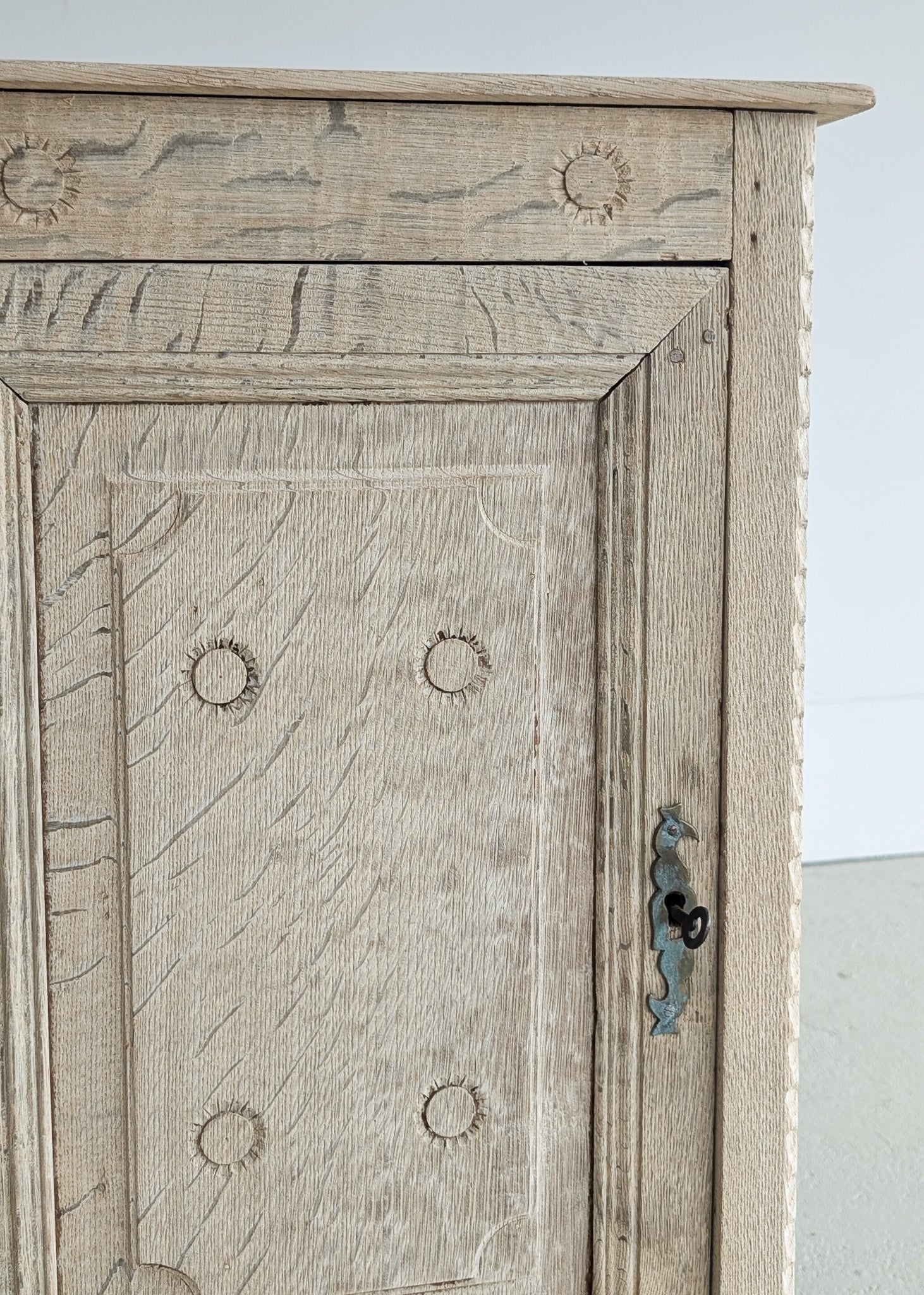 Antique European Bleached Oak Cabinet or Side Table with Hand-Carved Floral Detailing and Original Key
