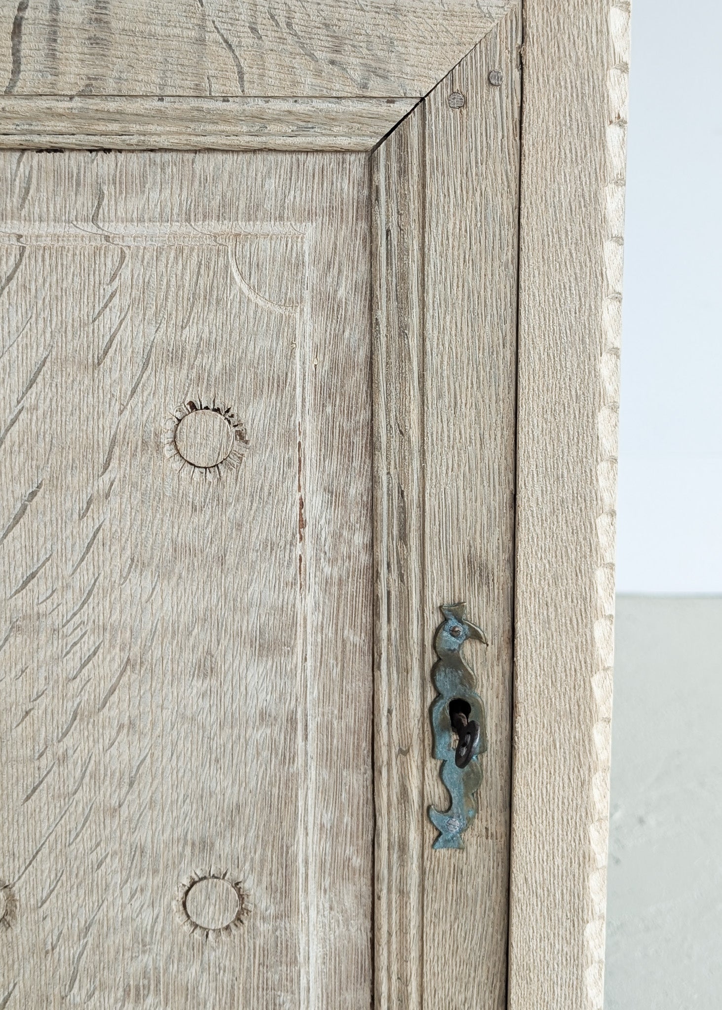 Antique European Bleached Oak Cabinet or Side Table with Hand-Carved Floral Detailing and Original Key