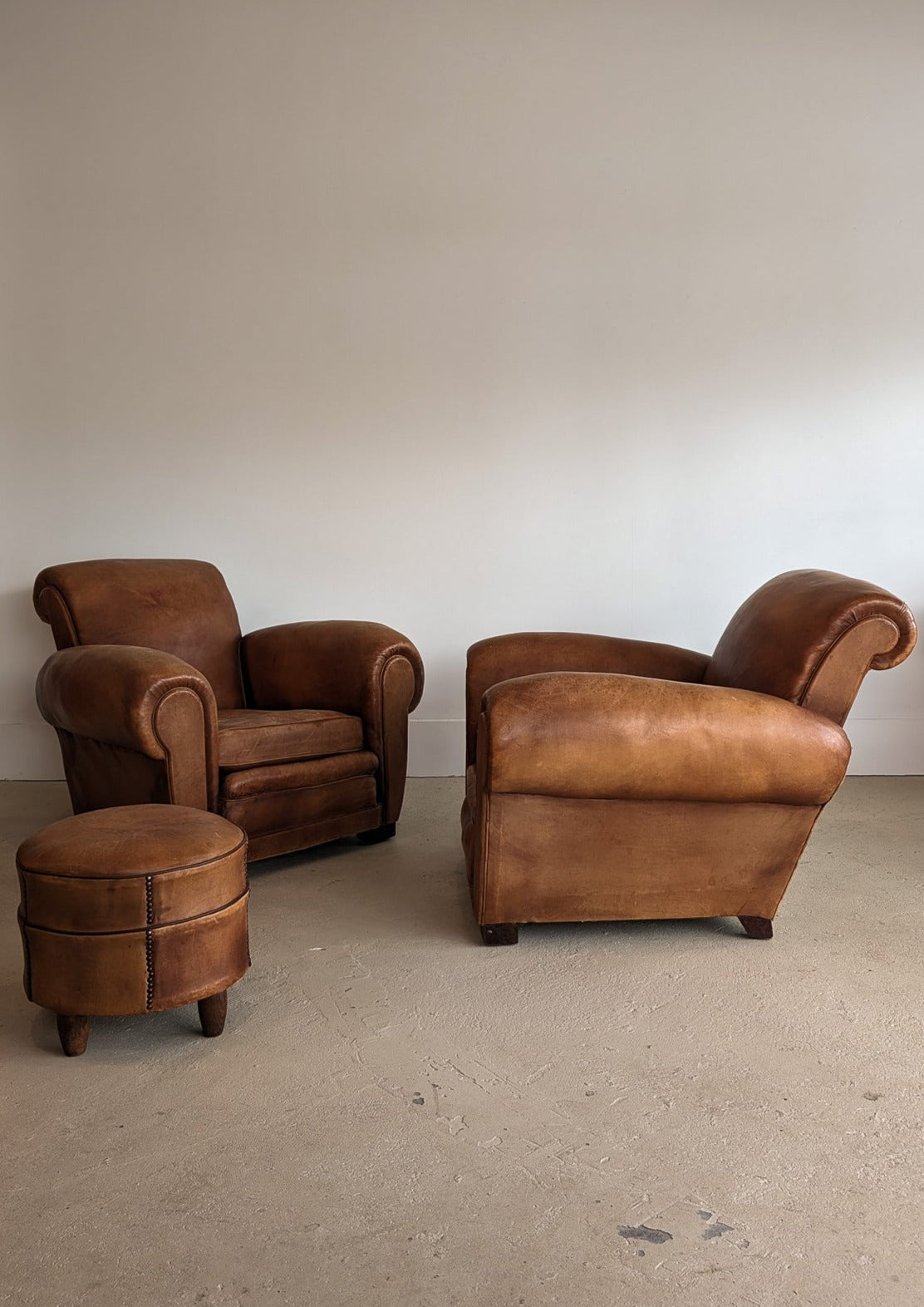 Pair of Vintage 1970s French Leather Club Chairs and Matching Leather Hassock