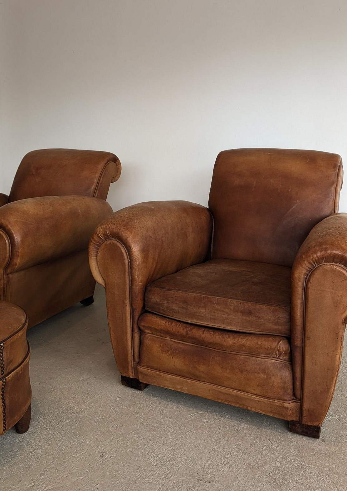 Pair of Vintage 1970s French Leather Club Chairs and Matching Leather Hassock