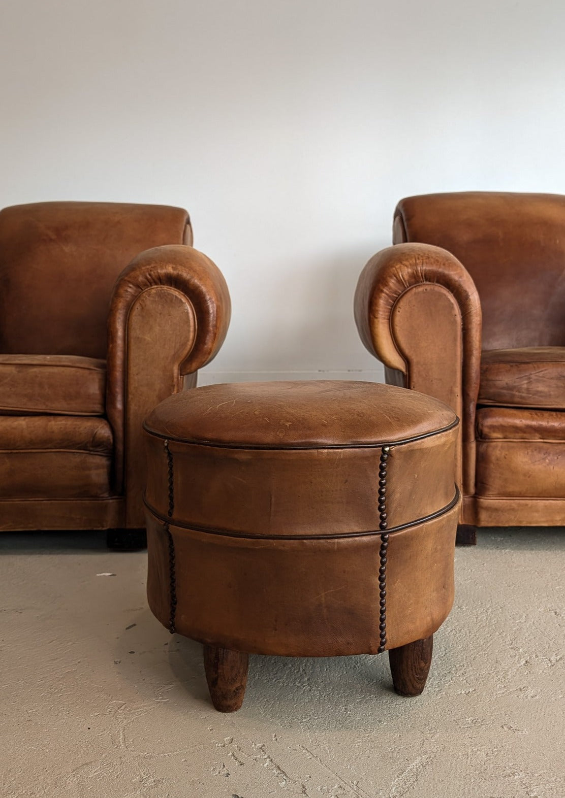 Pair of Vintage 1970s French Leather Club Chairs and Matching Leather Hassock