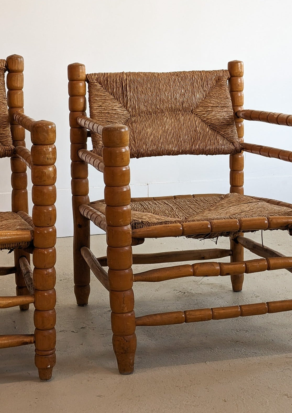 Pair of Vintage Midcentury European Charles Dudouyt-Style Hand-turned Rush and Wood Chairs