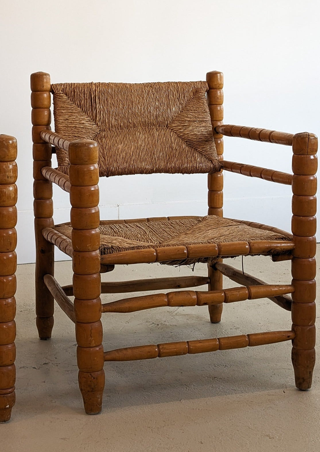 Pair of Vintage Midcentury European Charles Dudouyt-Style Hand-turned Rush and Wood Chairs