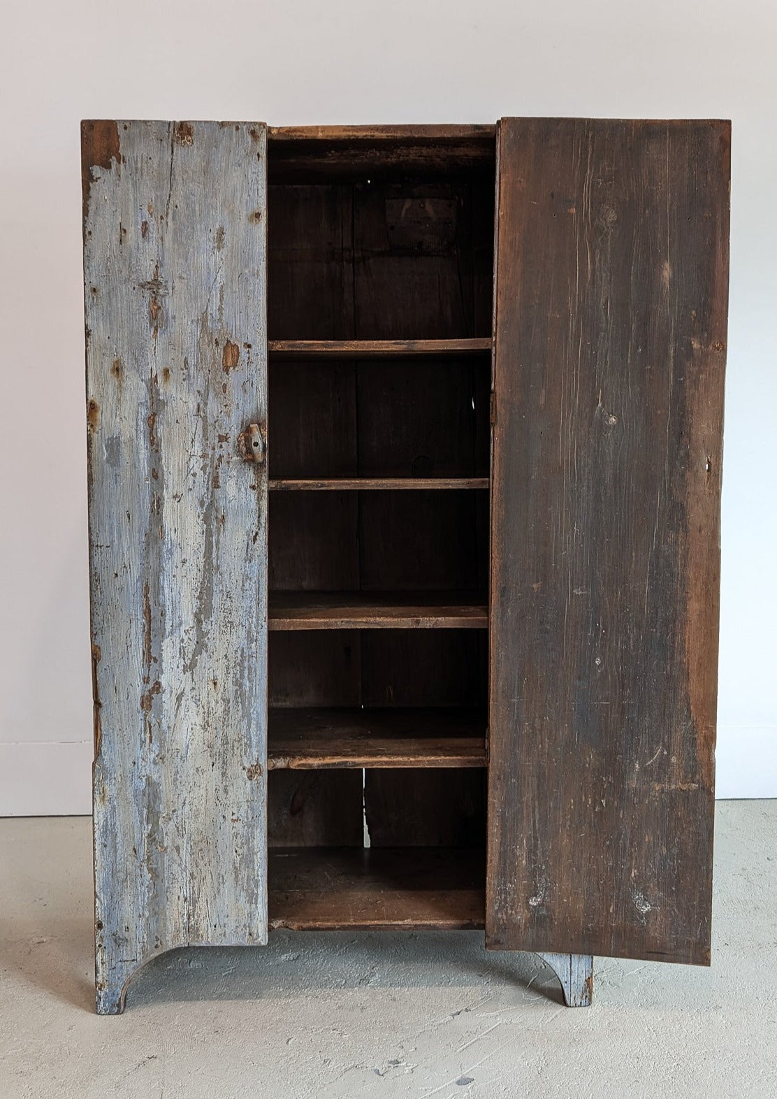 Early 1800s Primitive Blue Cabinet with Brass Stitch Detailing and Square Head Nails