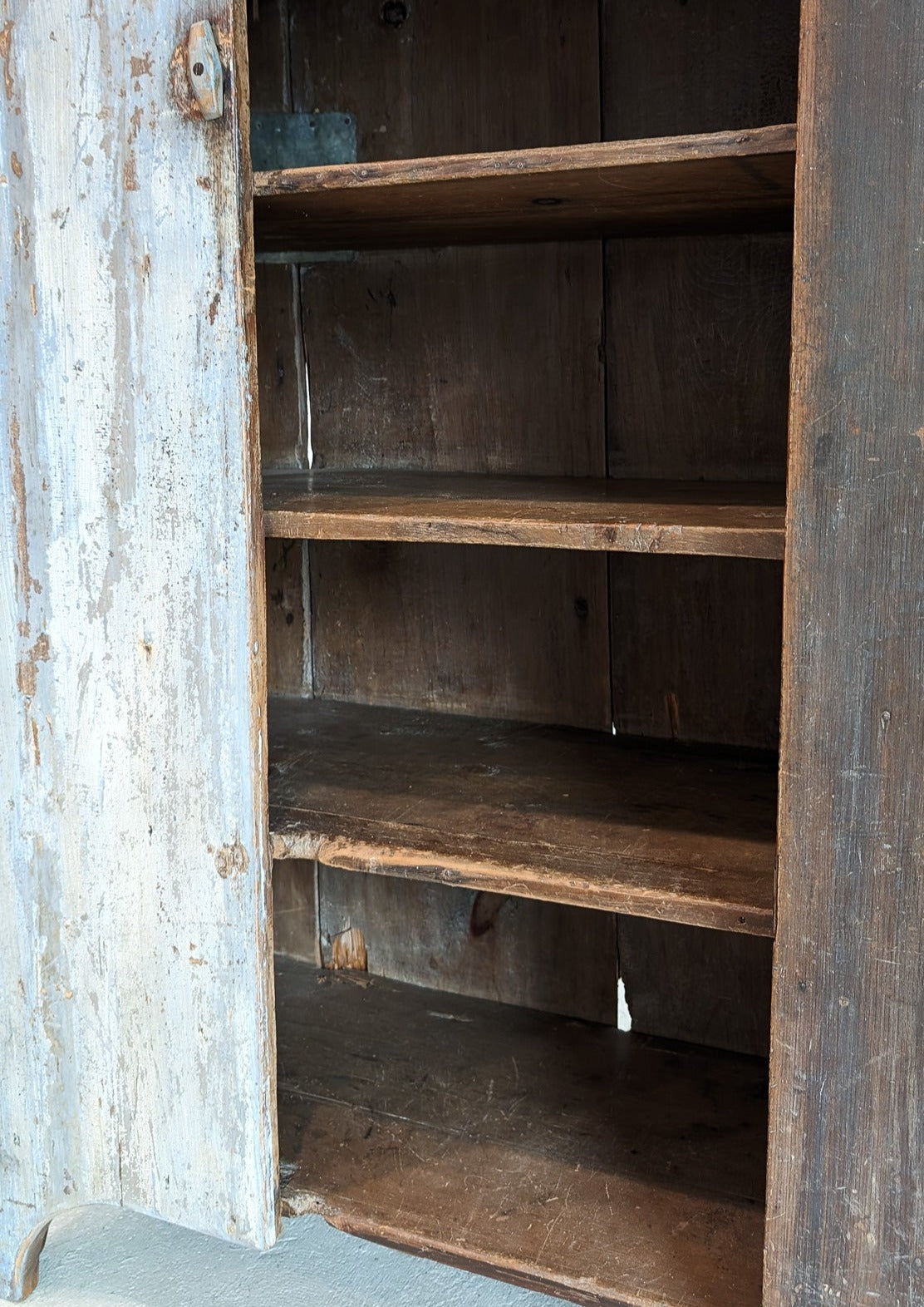 Early 1800s Primitive Blue Cabinet with Brass Stitch Detailing and Square Head Nails