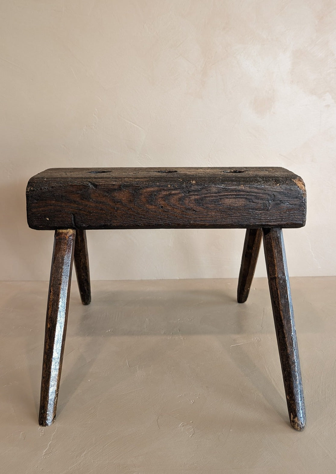 Dark Wooden Primitive Handmade Stool with Holes on Top