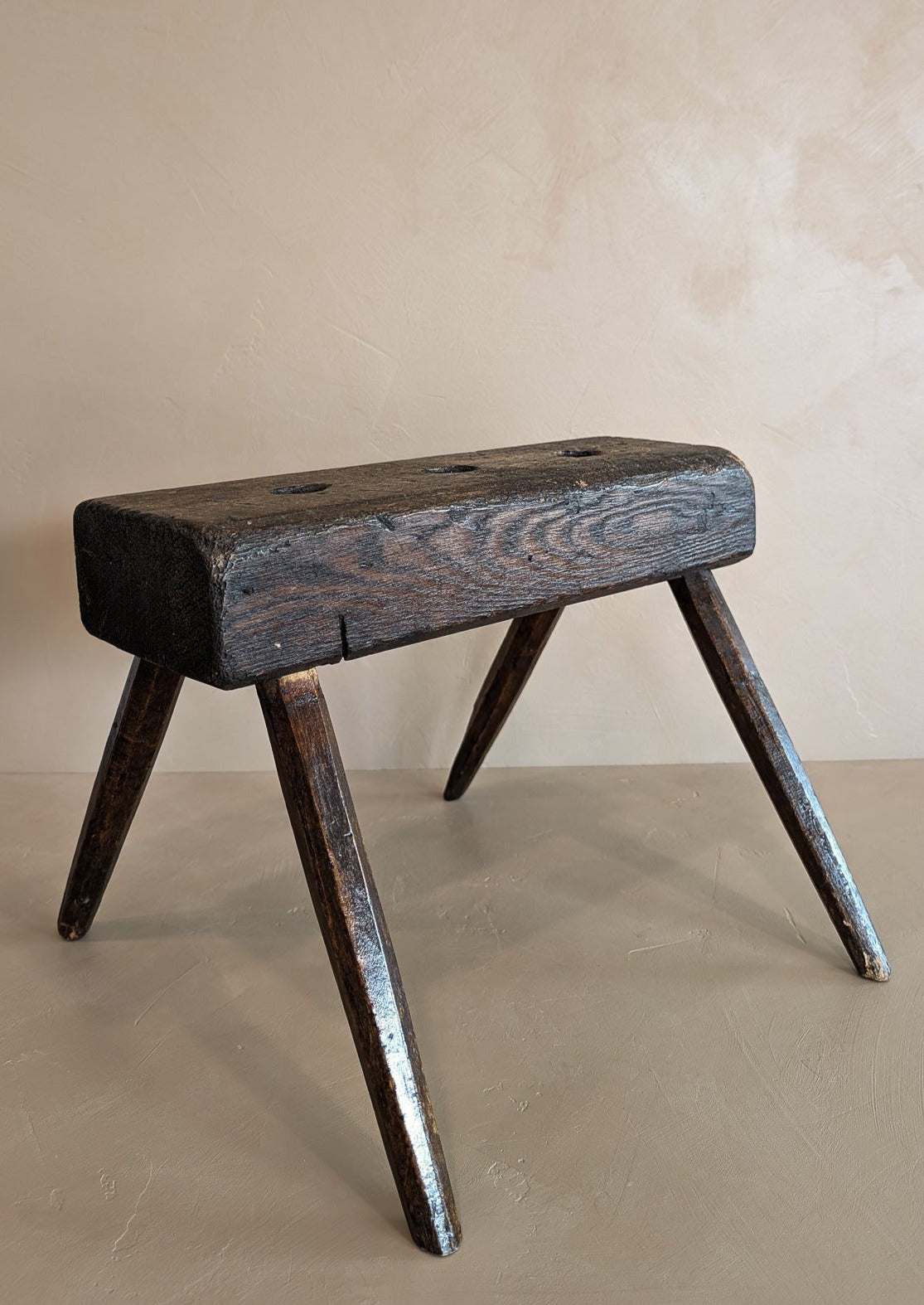 Dark Wooden Primitive Handmade Stool with Holes on Top