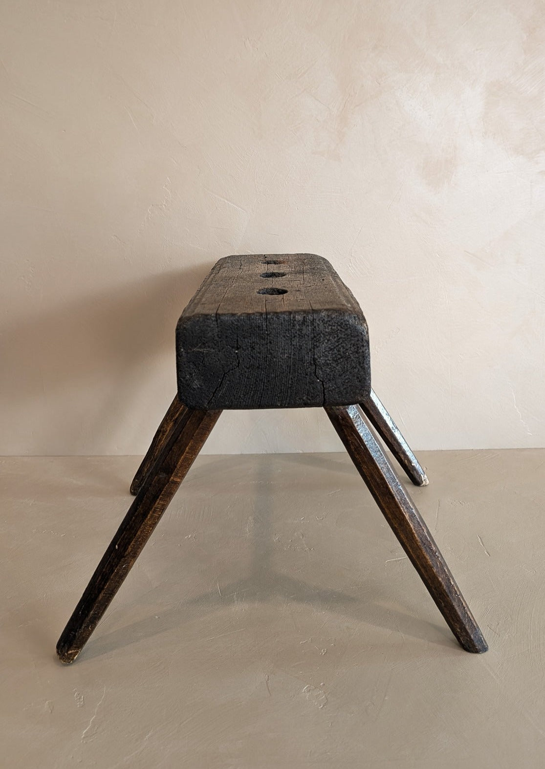 Dark Wooden Primitive Handmade Stool with Holes on Top