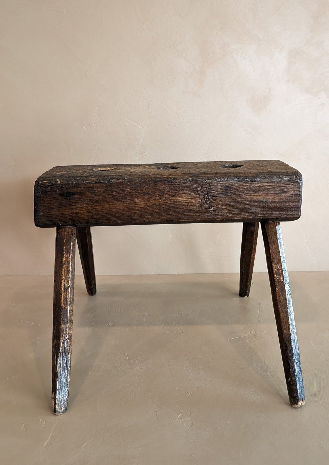 Dark Wooden Primitive Handmade Stool with Holes on Top