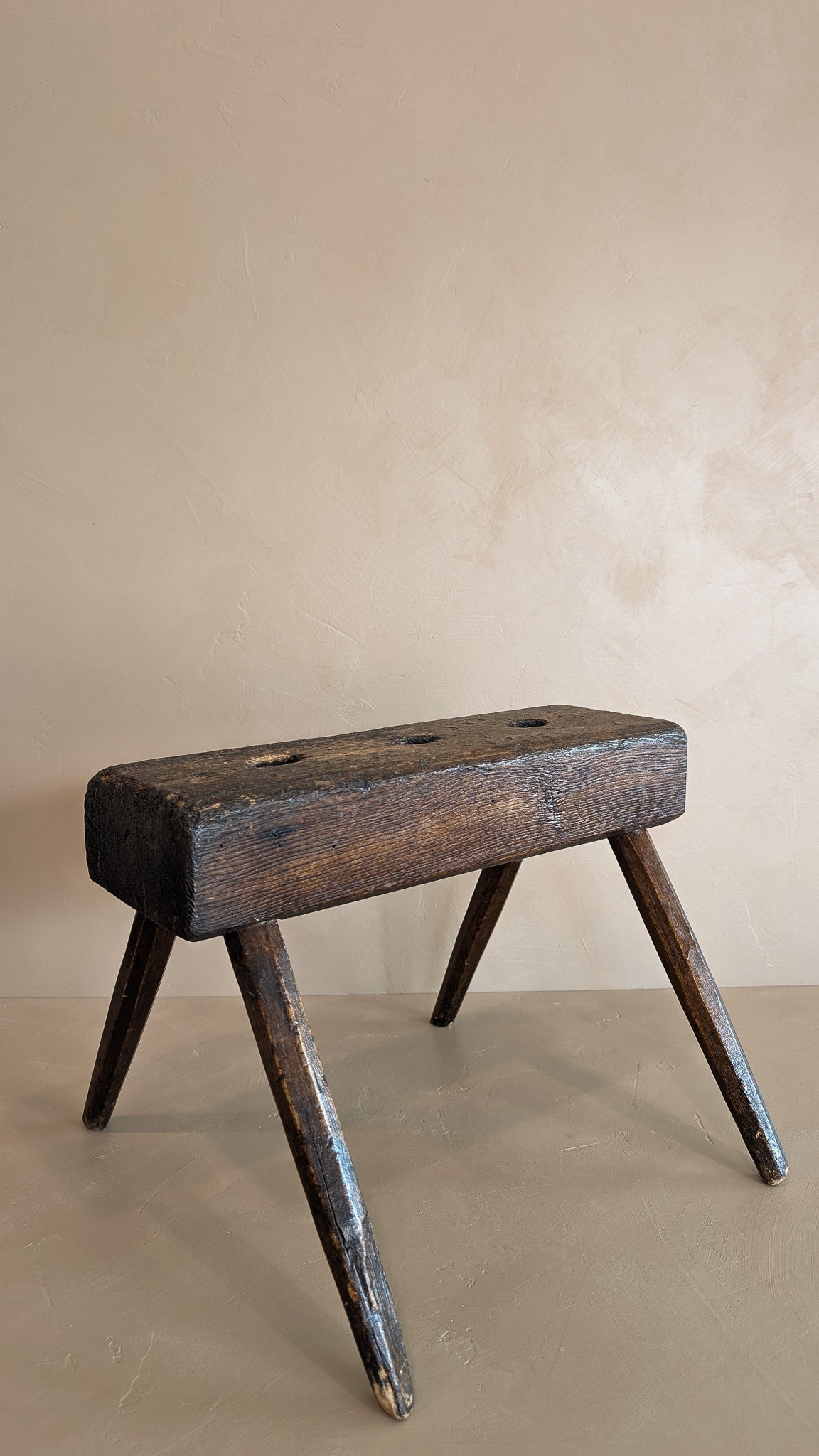 Dark Wooden Primitive Handmade Stool with Holes on Top