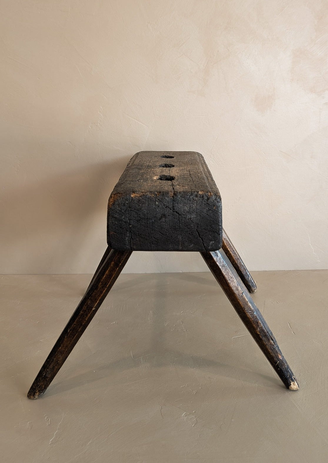 Dark Wooden Primitive Handmade Stool with Holes on Top