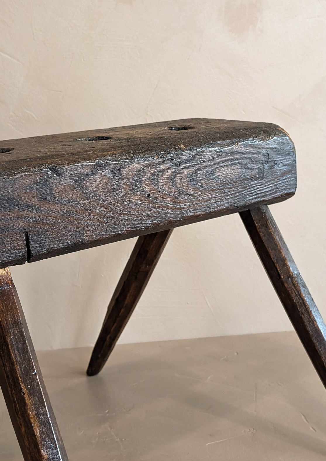 Dark Wooden Primitive Handmade Stool with Holes on Top