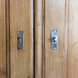 Handsome Antique European Pine Cabinet with Arched Panel Doors, Carved Feet and Skeleton Key