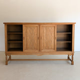 Vintage Midcentury Danish Henning Kjærnulf-Attributed Tall Oak Sideboard Cabinet with Carved Sliding Doors