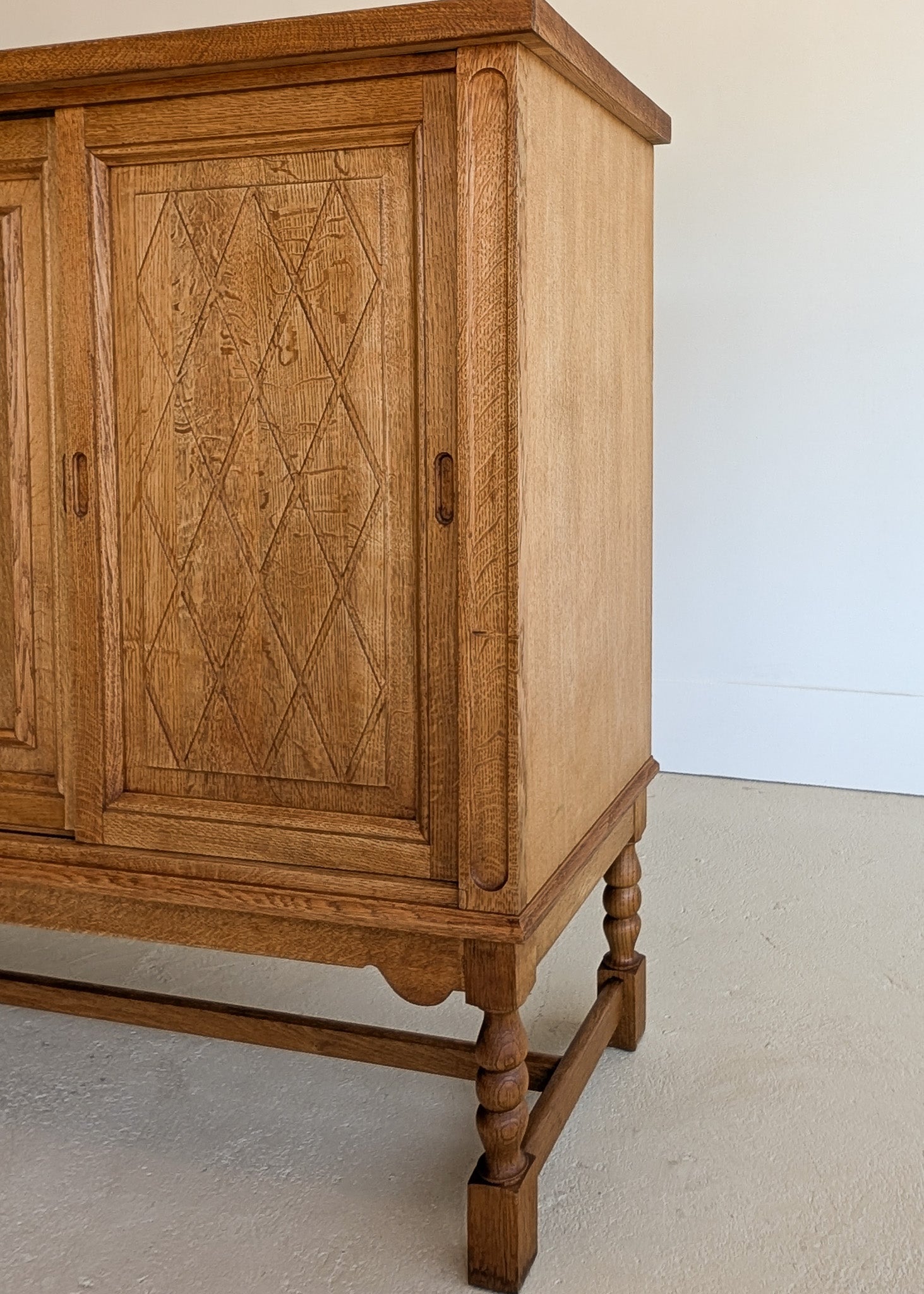 Vintage Midcentury Danish Henning Kjærnulf-Attributed Tall Oak Sideboard Cabinet with Carved Sliding Doors