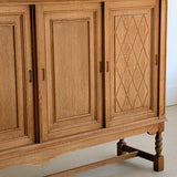 Vintage Midcentury Danish Henning Kjærnulf-Attributed Tall Oak Sideboard Cabinet with Carved Sliding Doors
