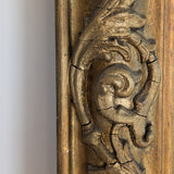 Large Antique Gilded Plaster and Wood Mirror with Wavy Glass