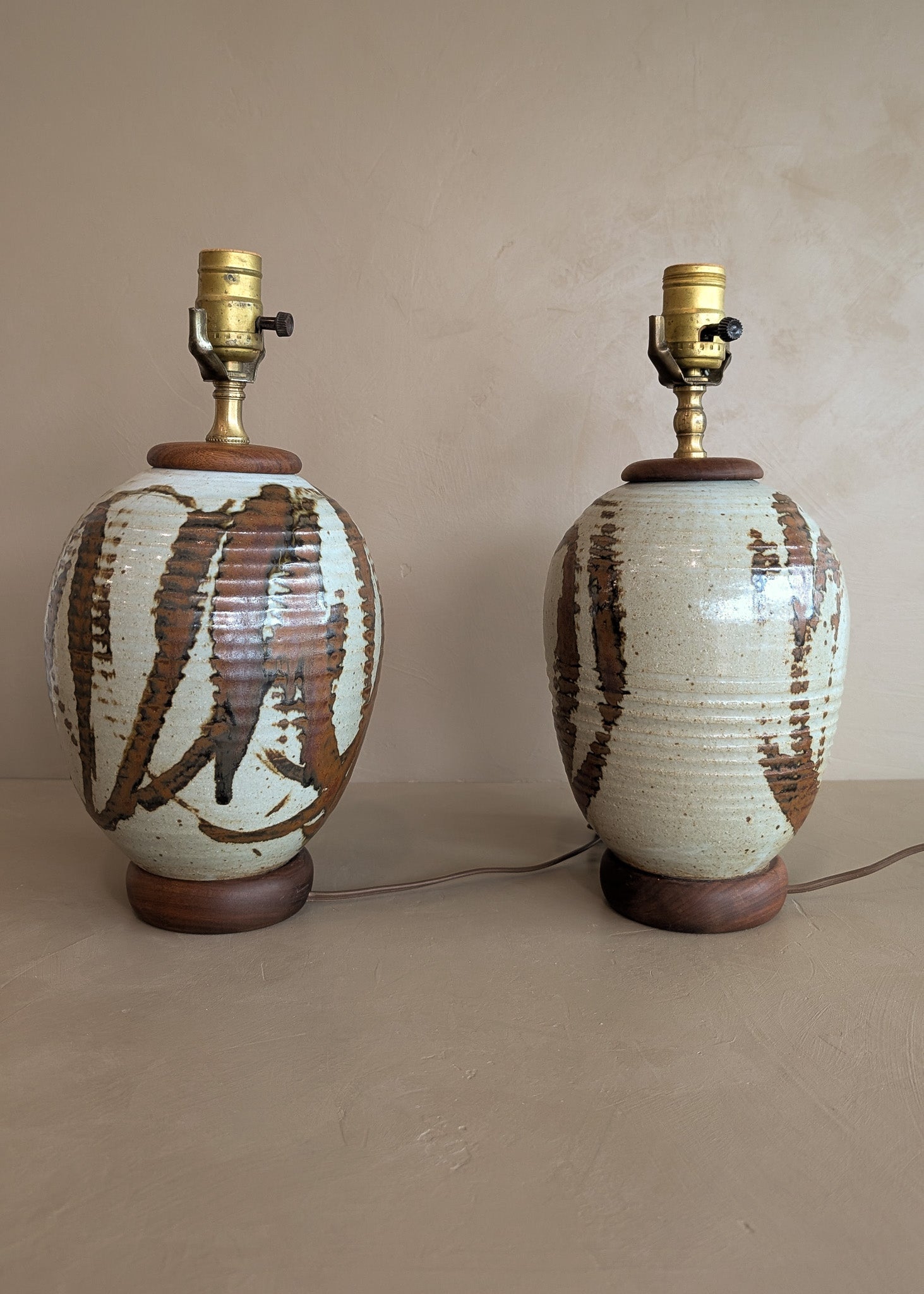 Pair of Vintage Neutral Studio Pottery and Teak Wood Lamps with Freeform Detailing