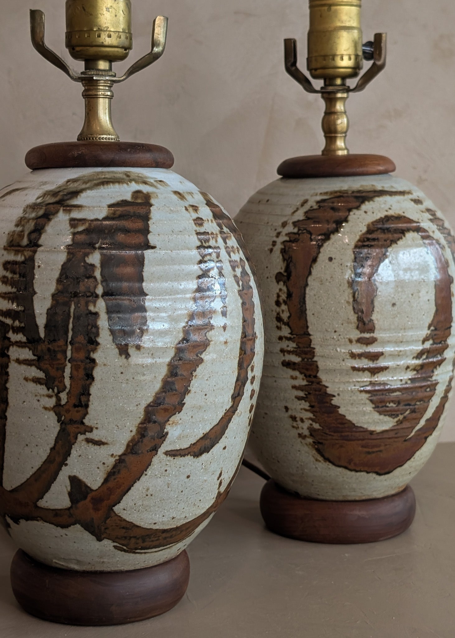 Pair of Vintage Neutral Studio Pottery and Teak Wood Lamps with Freeform Detailing