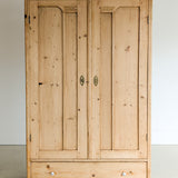 Antique European Light Pine Cabinet with Hand-Carved Detailing and Bottom Drawer