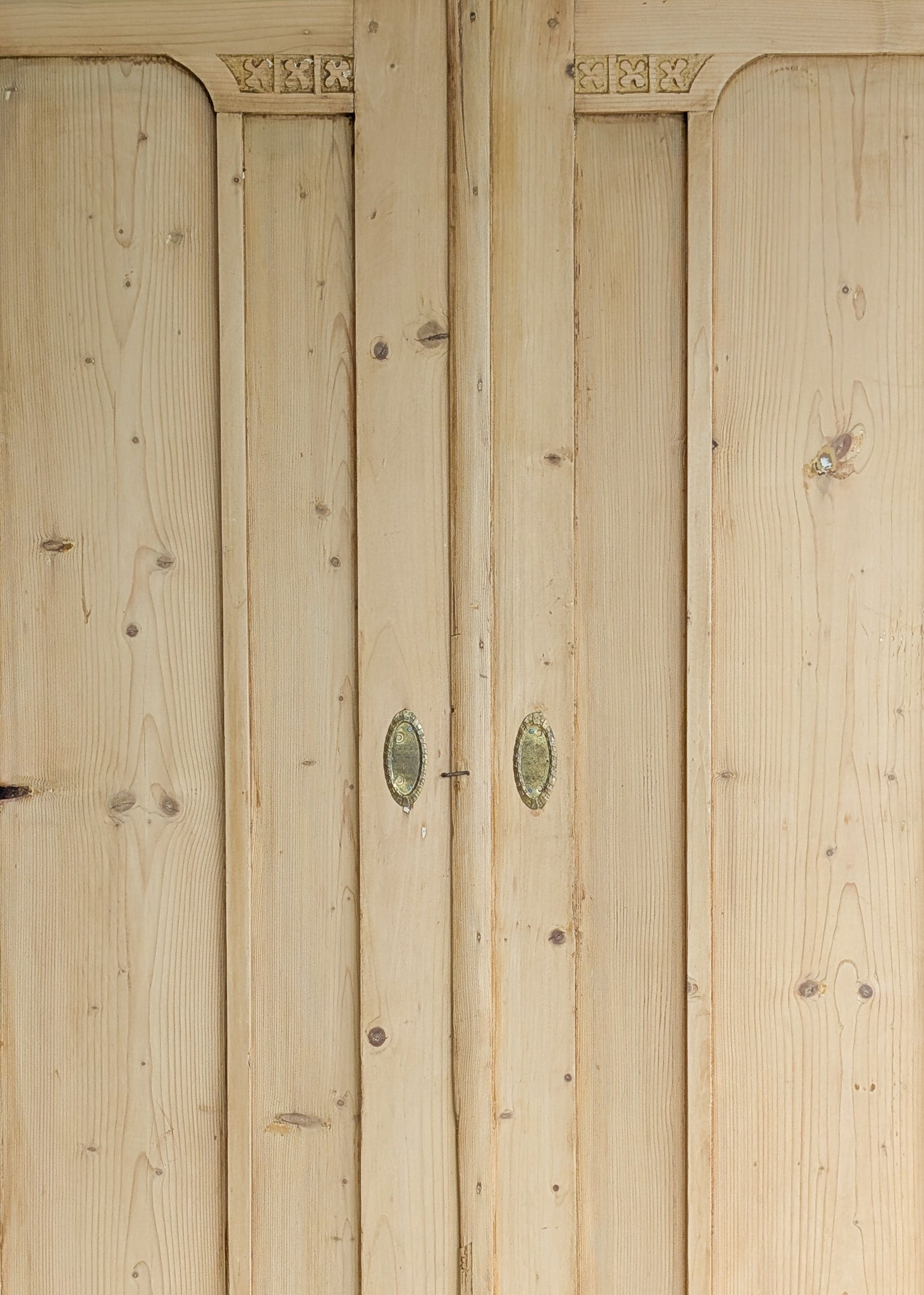 Antique European Light Pine Cabinet with Hand-Carved Detailing and Bottom Drawer