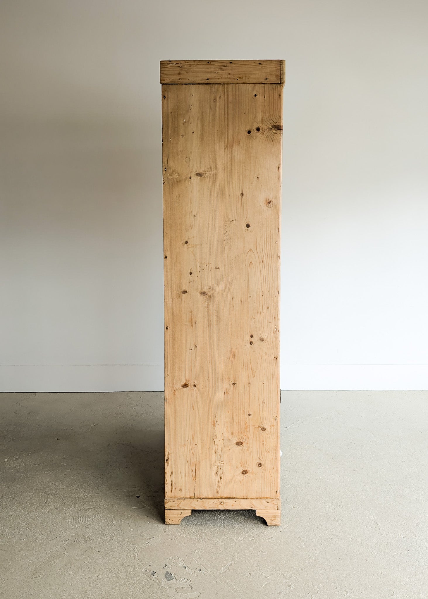 Antique European Light Pine Cabinet with Hand-Carved Detailing and Bottom Drawer