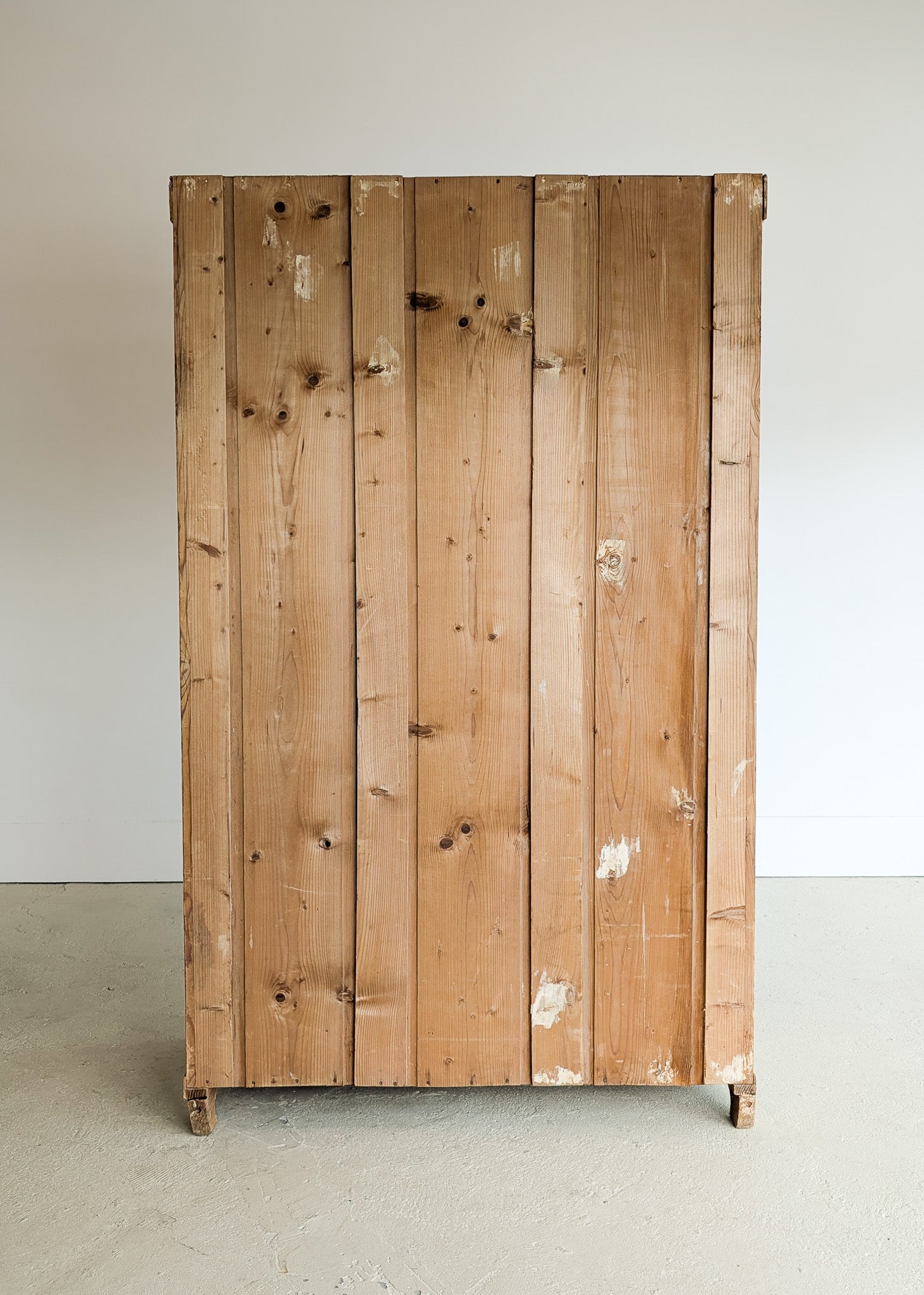 Antique European Light Pine Cabinet with Hand-Carved Detailing and Bottom Drawer