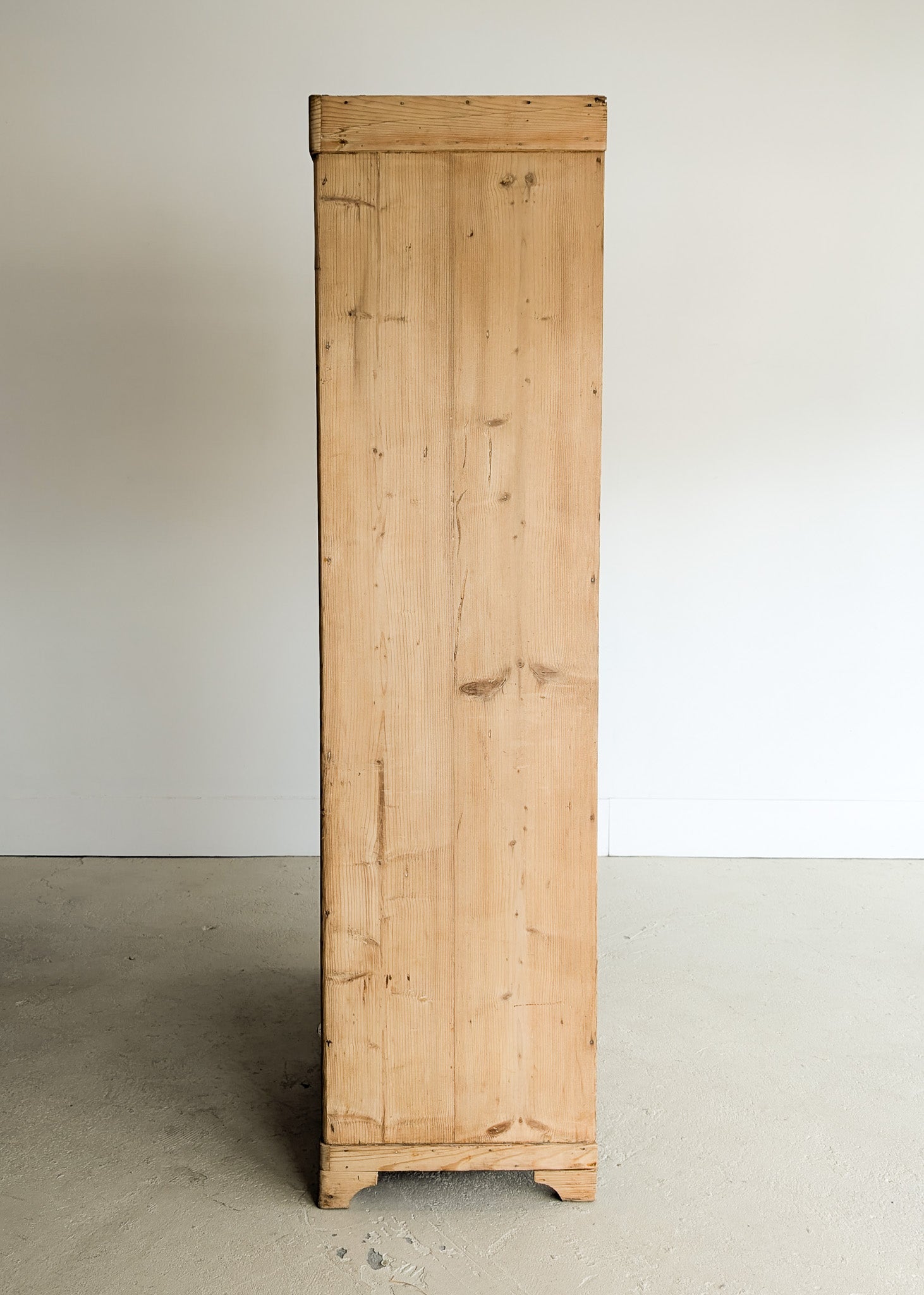 Antique European Light Pine Cabinet with Hand-Carved Detailing and Bottom Drawer