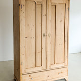 Antique European Light Pine Cabinet with Hand-Carved Detailing and Bottom Drawer