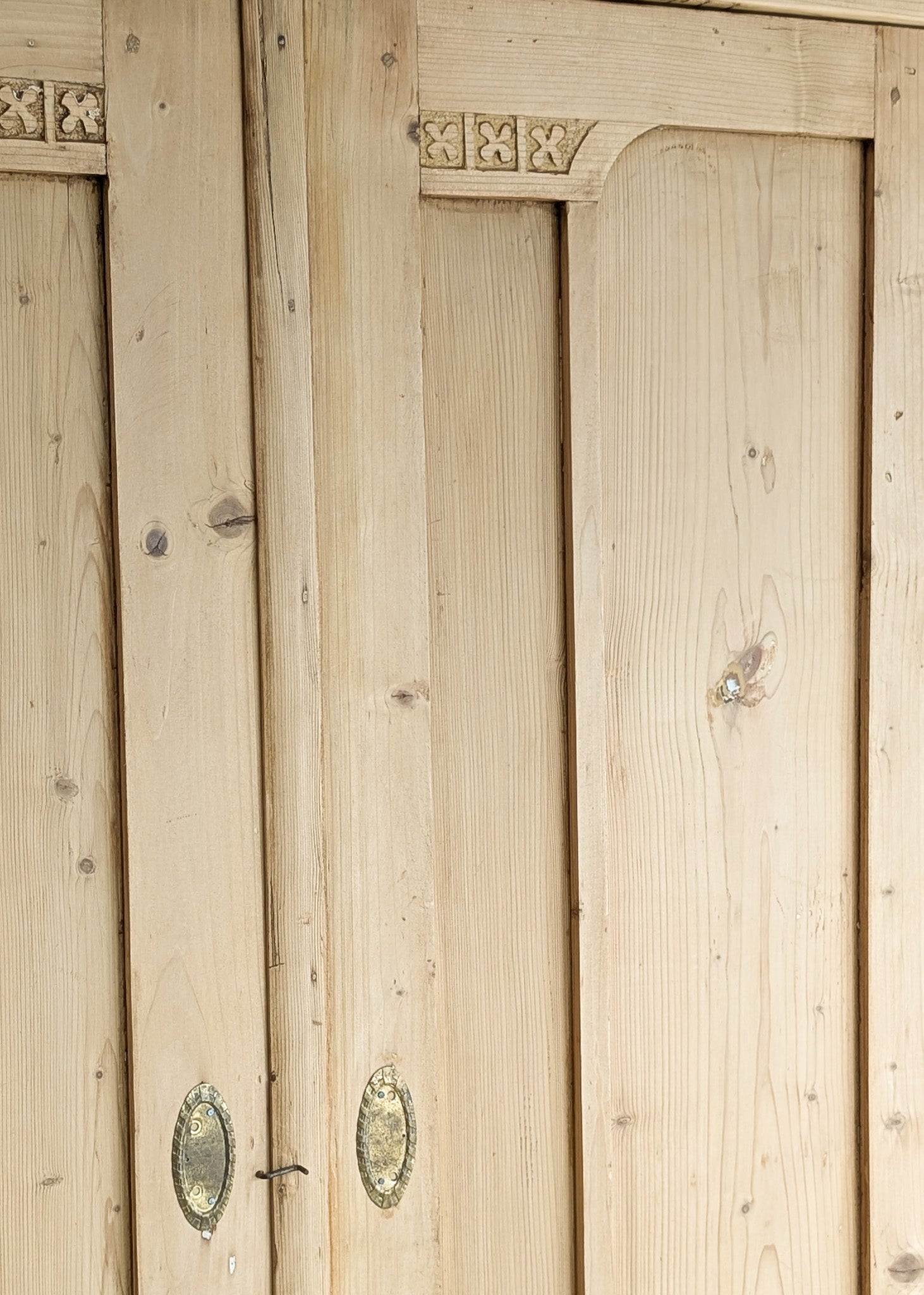 Antique European Light Pine Cabinet with Hand-Carved Detailing and Bottom Drawer