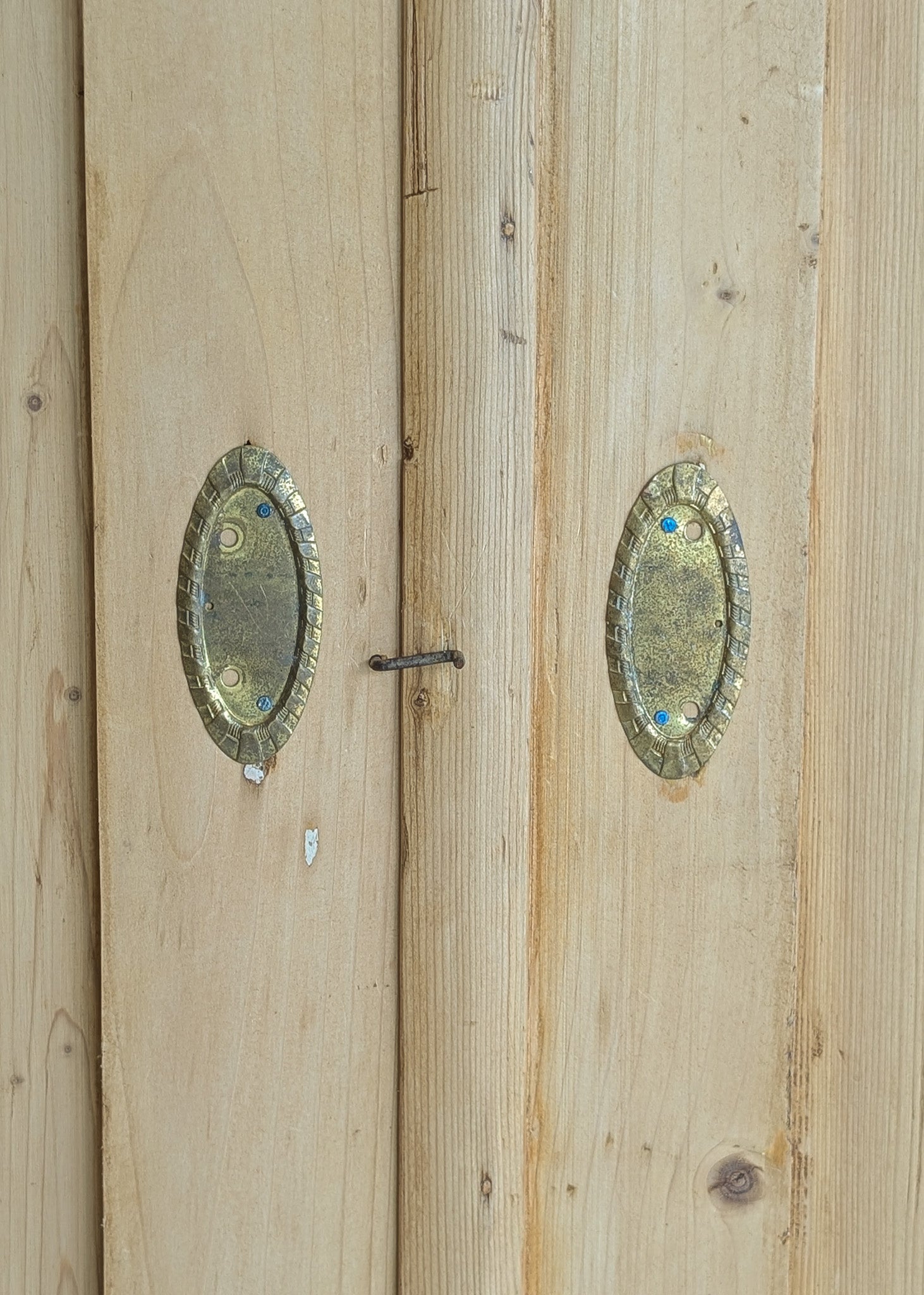 Antique European Light Pine Cabinet with Hand-Carved Detailing and Bottom Drawer