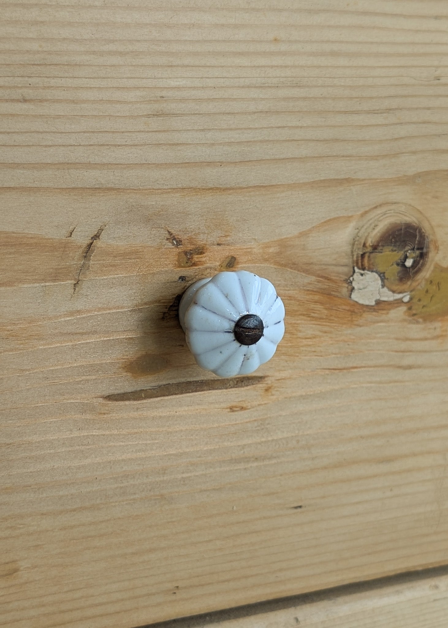 Antique European Light Pine Cabinet with Hand-Carved Detailing and Bottom Drawer