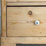 Antique European Light Pine Cabinet with Hand-Carved Detailing and Bottom Drawer