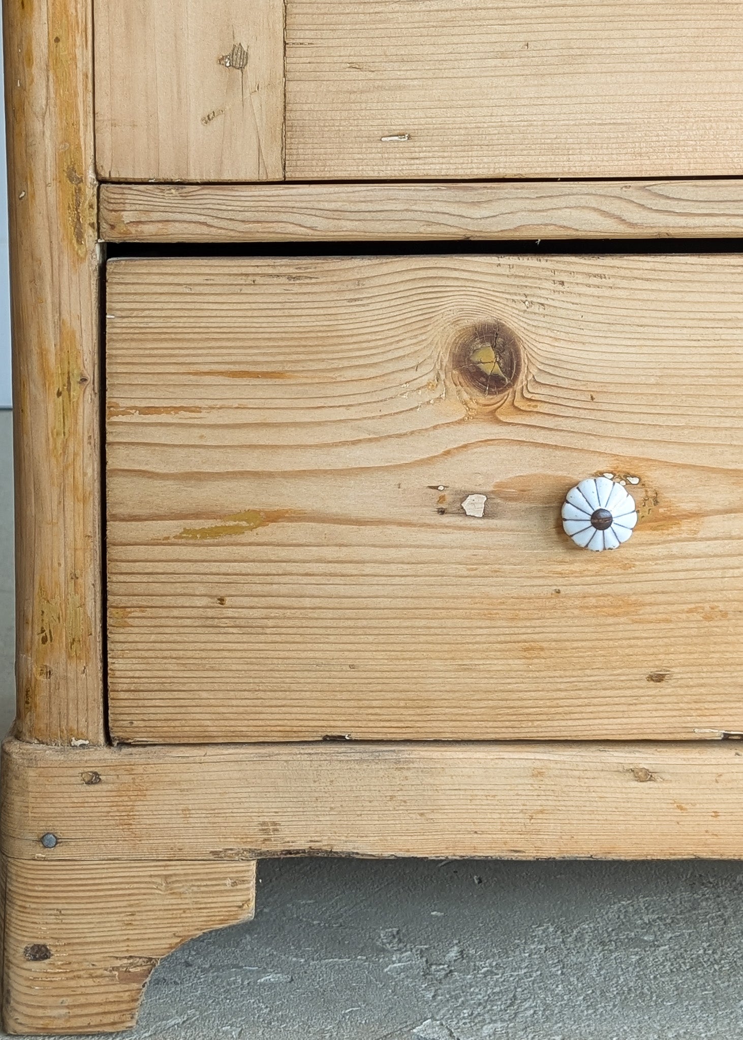 Antique European Light Pine Cabinet with Hand-Carved Detailing and Bottom Drawer