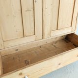 Antique European Light Pine Cabinet with Hand-Carved Detailing and Bottom Drawer