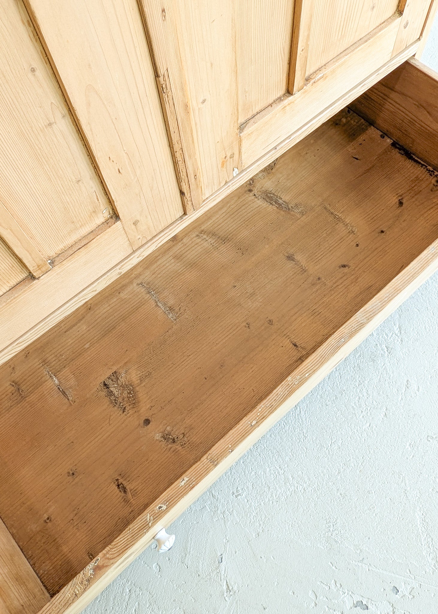 Antique European Light Pine Cabinet with Hand-Carved Detailing and Bottom Drawer