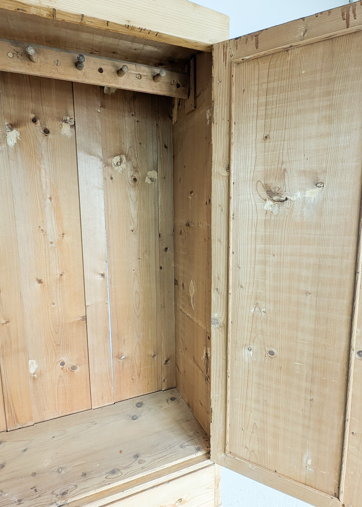 Antique European Light Pine Cabinet with Hand-Carved Detailing and Bottom Drawer