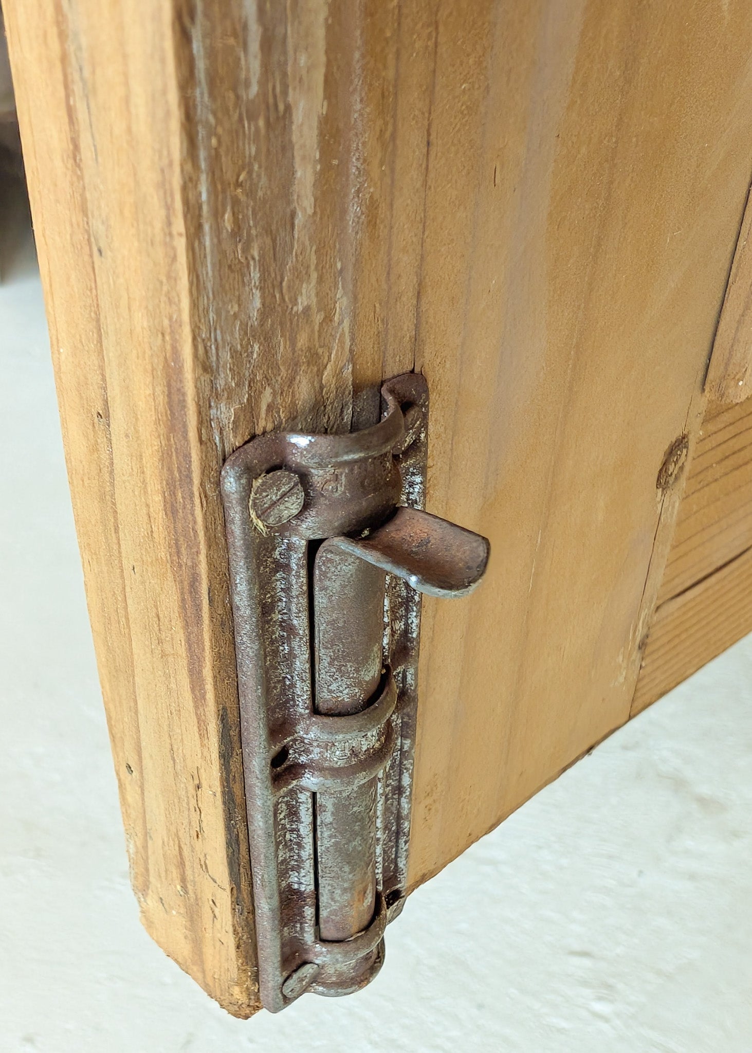 Antique European Light Pine Cabinet with Hand-Carved Detailing and Bottom Drawer