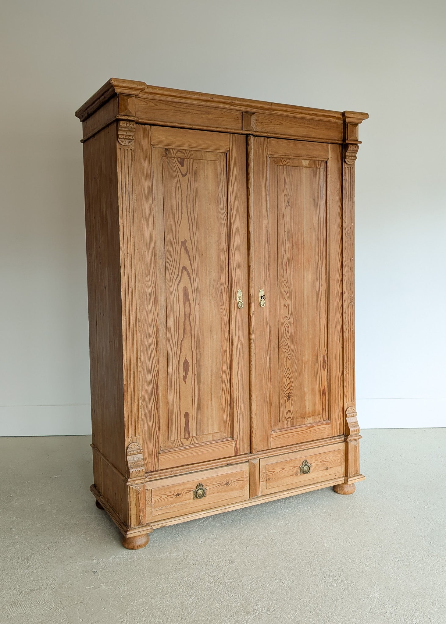 Handsome Antique European Pine Two-Door Cabinet with Bottom Drawer and Skeleton Key