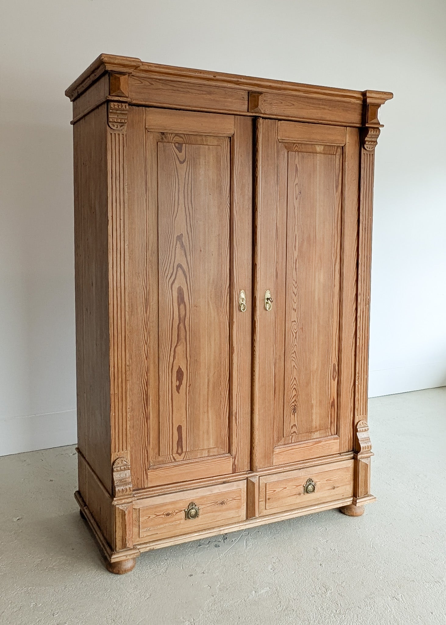Handsome Antique European Pine Two-Door Cabinet with Bottom Drawer and Skeleton Key
