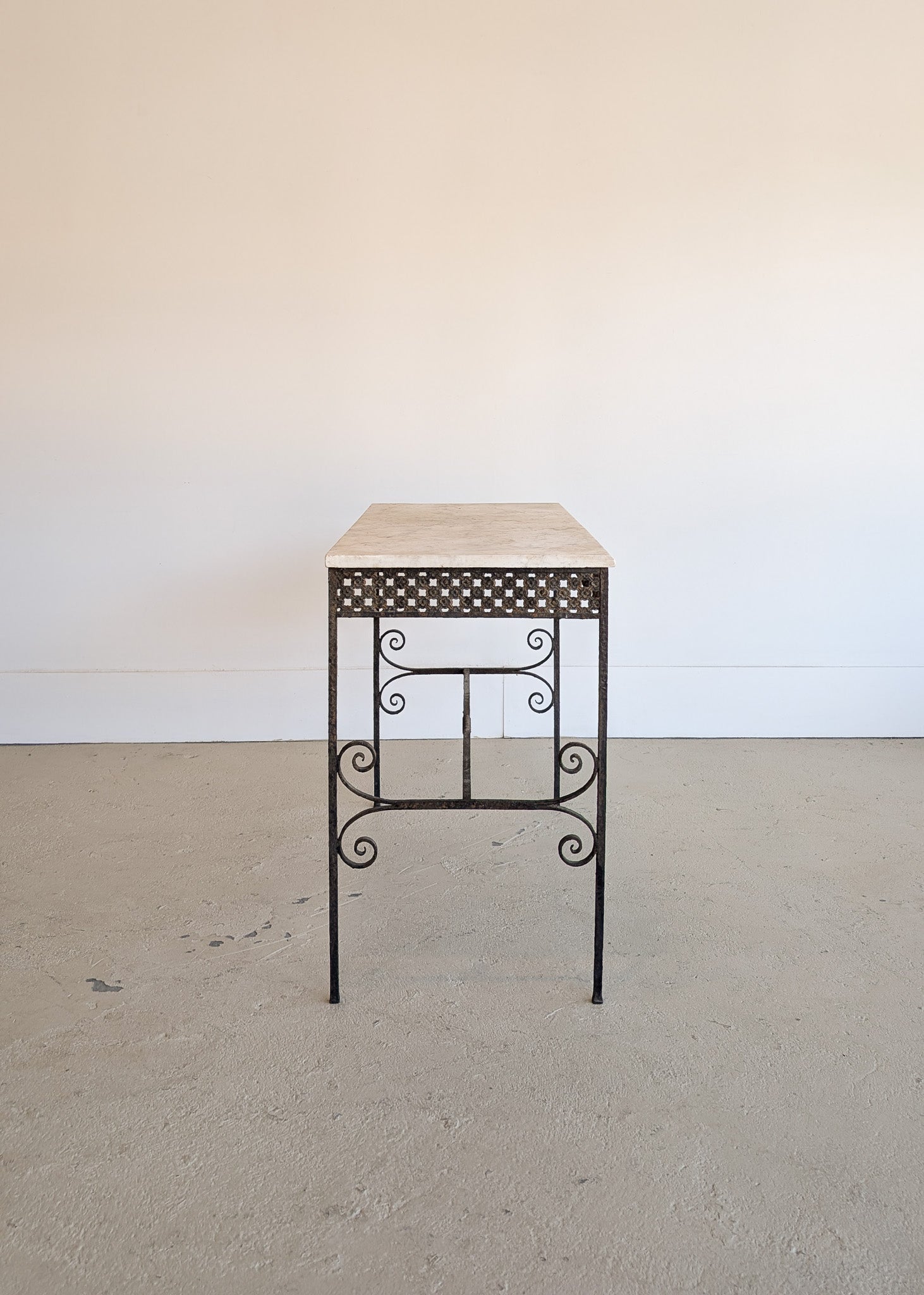 Antique French Marble-Top Console Table with Wrought Iron Base and Quatrefoil Apron and Scroll Detailing