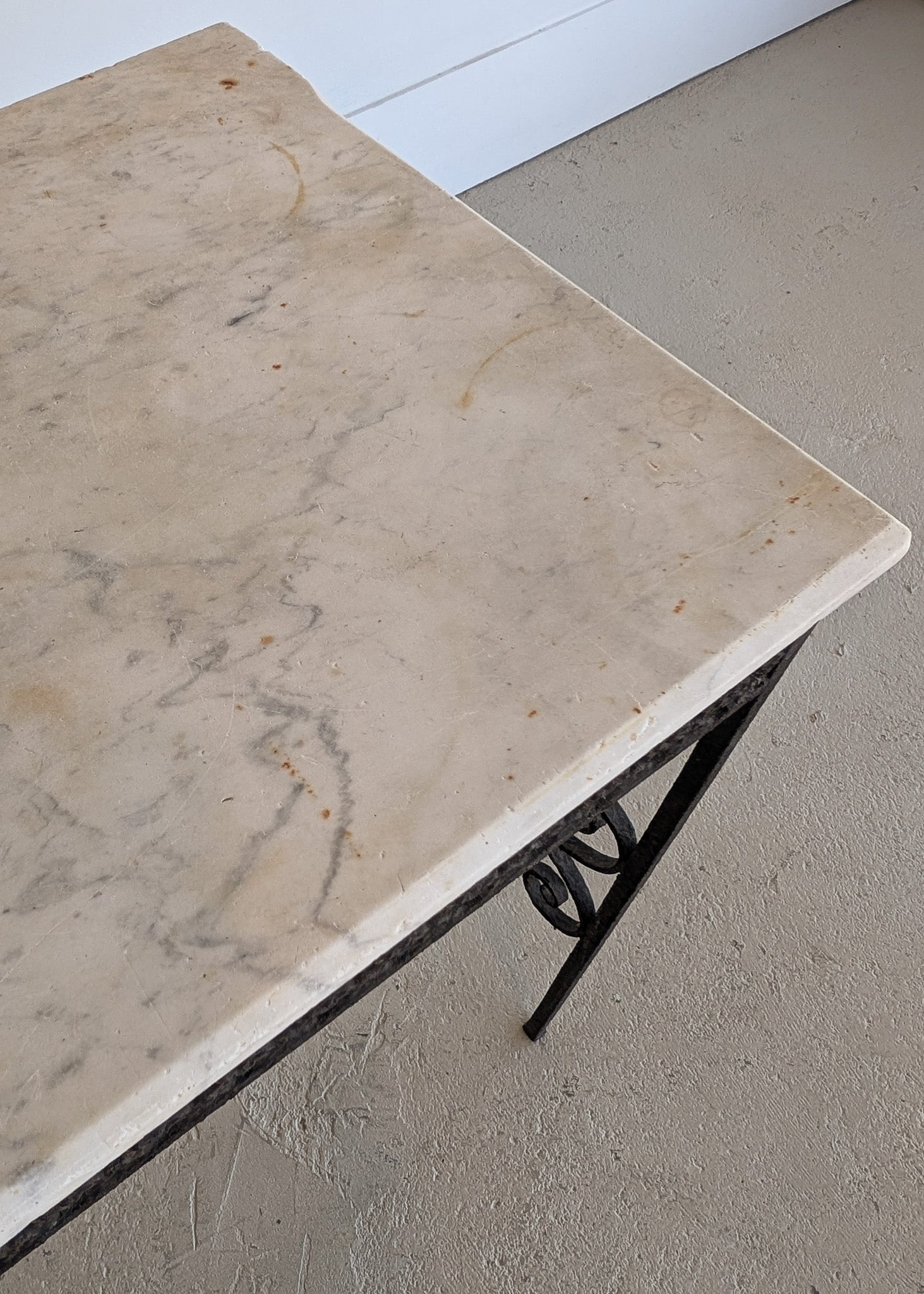 Antique French Marble-Top Console Table with Wrought Iron Base and Quatrefoil Apron and Scroll Detailing